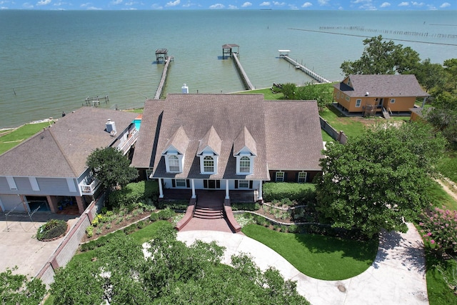 birds eye view of property with a water view