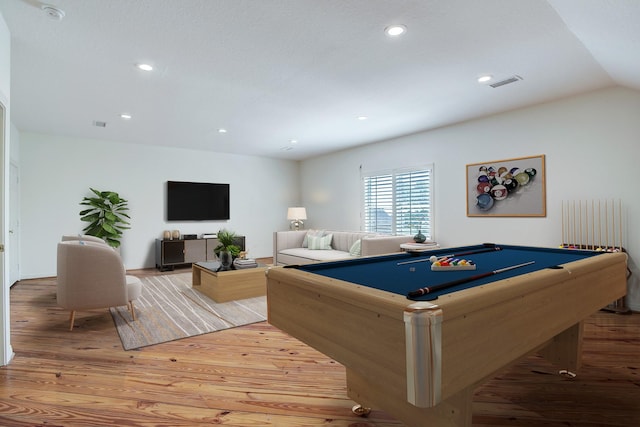 game room with light wood-type flooring, vaulted ceiling, and billiards