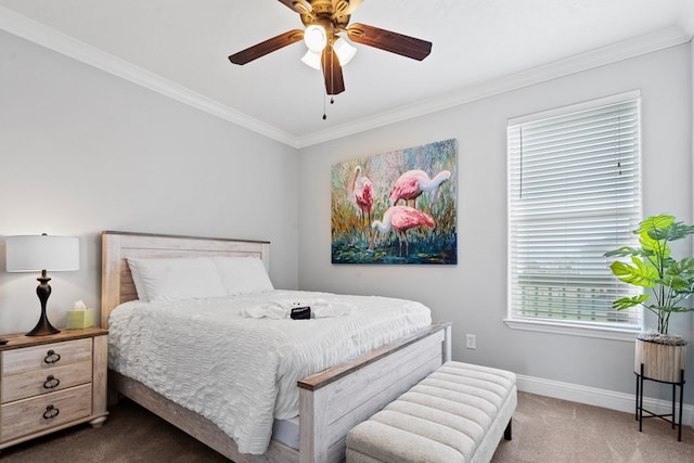 carpeted bedroom featuring ceiling fan and crown molding