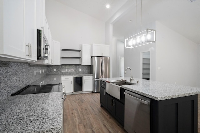 kitchen with beverage cooler, a sink, open shelves, white cabinetry, and appliances with stainless steel finishes