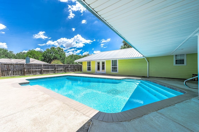 view of swimming pool with a patio and an outdoor structure