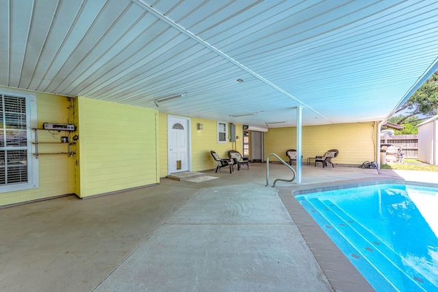 view of swimming pool featuring a patio