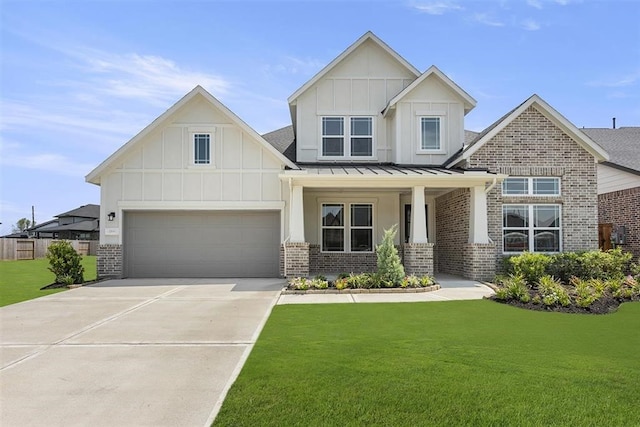 craftsman house with a front yard and a garage