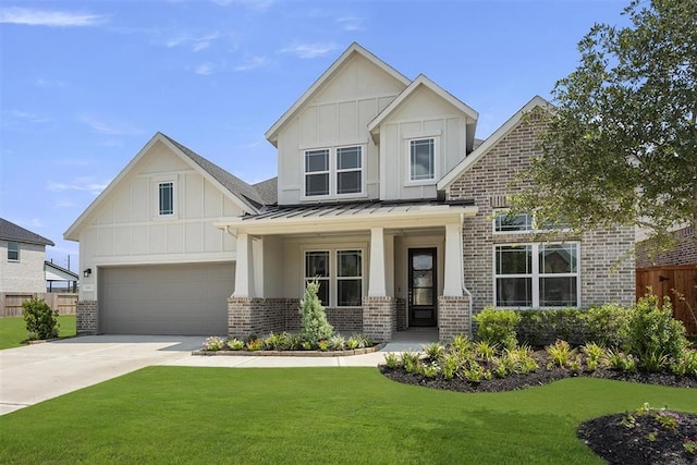 view of front of house with a garage, a porch, and a front lawn