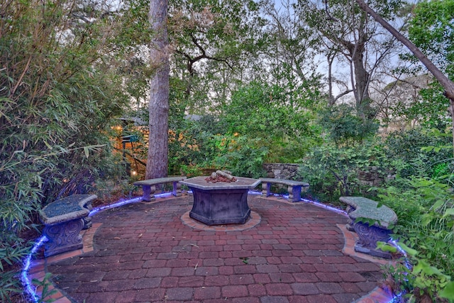 view of terrace featuring an outdoor fire pit