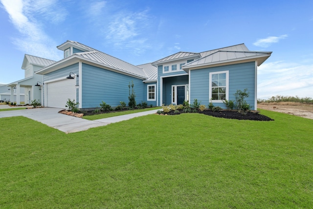 view of front facade with a front yard and a garage