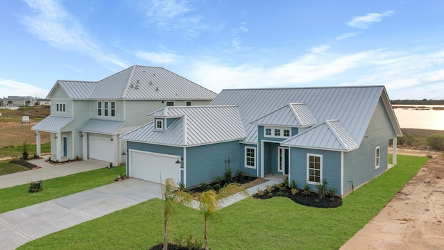 view of front of home featuring a front lawn and a garage