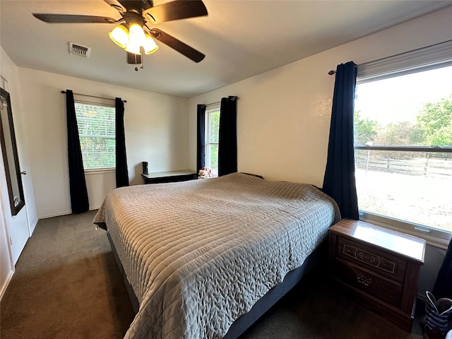 carpeted bedroom featuring ceiling fan