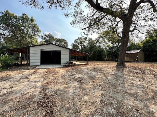 garage featuring a carport