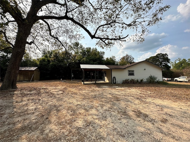 exterior space with a storage shed