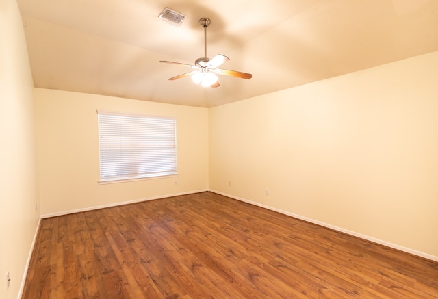 unfurnished room with vaulted ceiling, ceiling fan, and hardwood / wood-style flooring