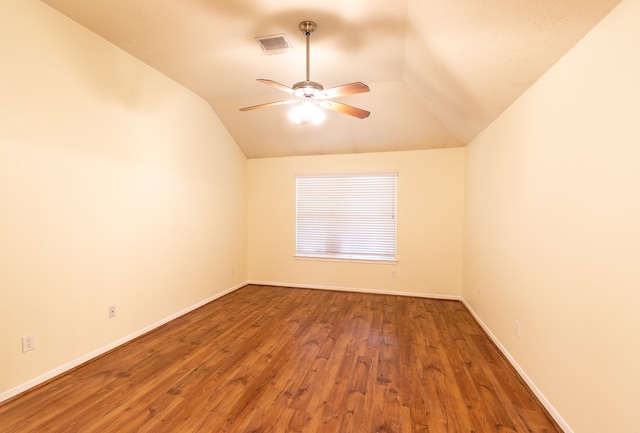 spare room featuring vaulted ceiling, ceiling fan, and hardwood / wood-style flooring