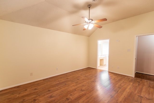 empty room featuring vaulted ceiling, ceiling fan, and hardwood / wood-style flooring