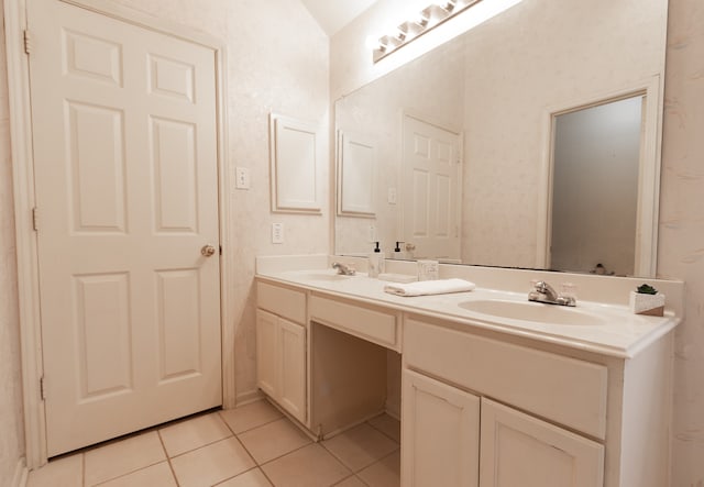 bathroom featuring tile patterned flooring and vanity