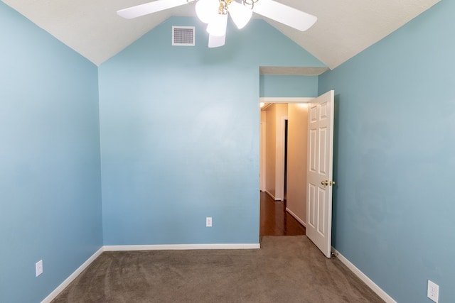 interior space featuring carpet flooring, lofted ceiling, and ceiling fan