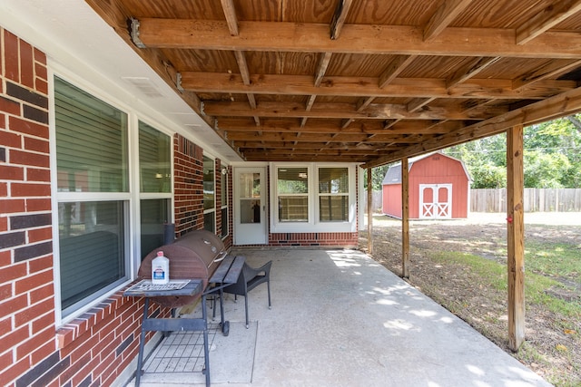 view of patio / terrace featuring a storage shed