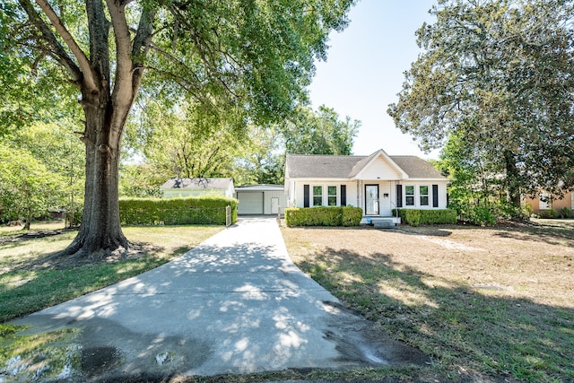 view of front facade with a front lawn and a garage