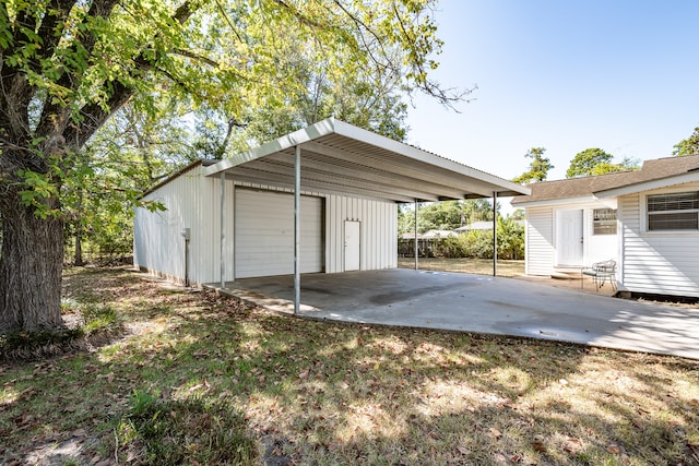 garage featuring a carport