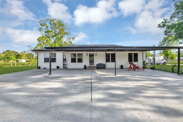 exterior space featuring a lawn and a carport