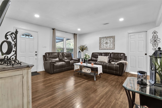 living room with dark hardwood / wood-style flooring