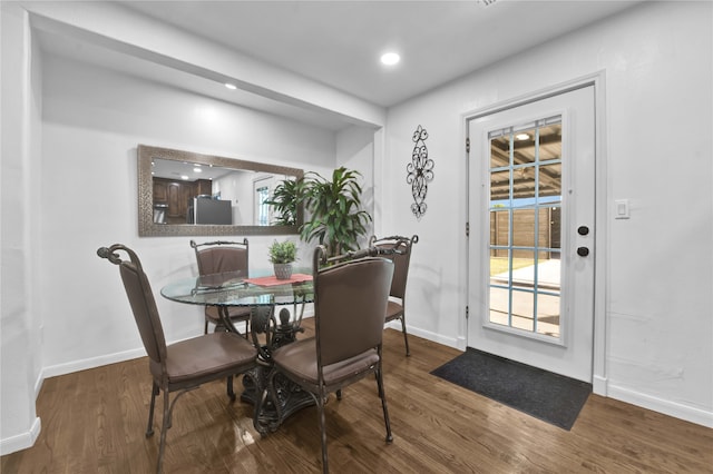 dining space featuring dark wood-type flooring