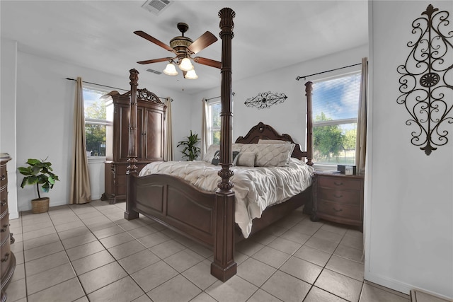 bedroom featuring ceiling fan and light tile floors