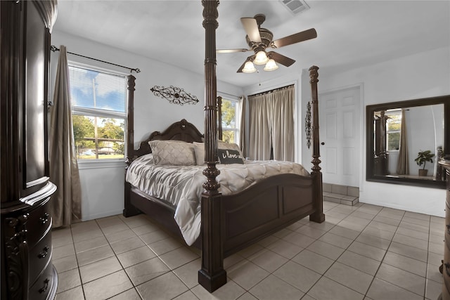 bedroom with light tile floors and ceiling fan