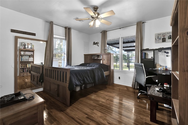 bedroom featuring ceiling fan and dark wood-type flooring