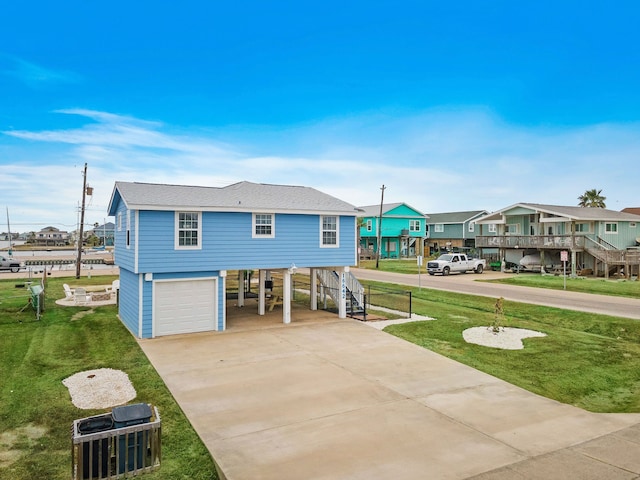 view of front facade featuring a front lawn and a garage