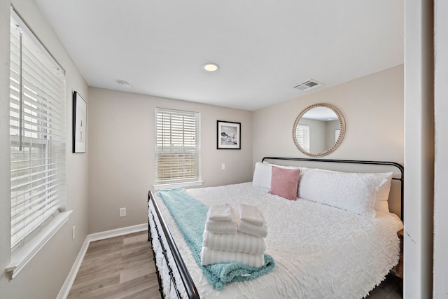 bedroom with light hardwood / wood-style floors