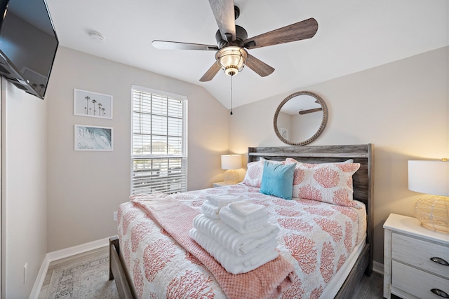 bedroom featuring ceiling fan and dark wood-type flooring