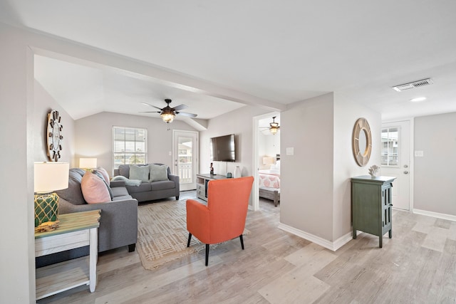 living room featuring light hardwood / wood-style floors and ceiling fan