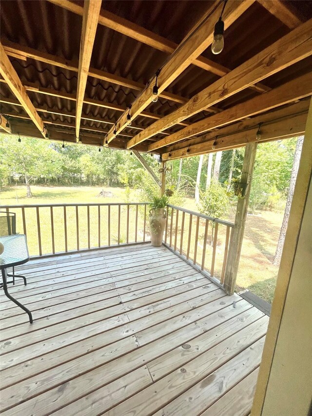 deck featuring a lawn