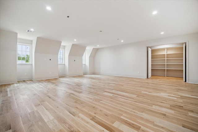 empty room featuring visible vents, recessed lighting, baseboards, and light wood-style floors