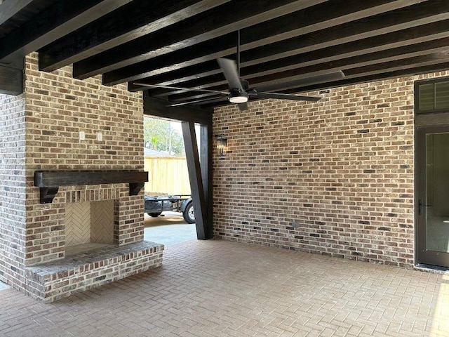 view of patio with a fireplace