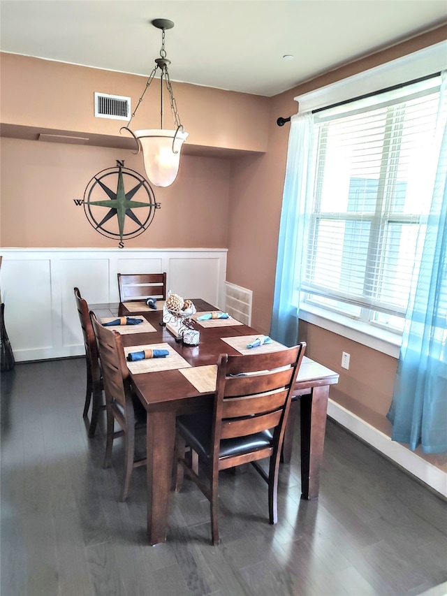 dining area featuring dark hardwood / wood-style flooring