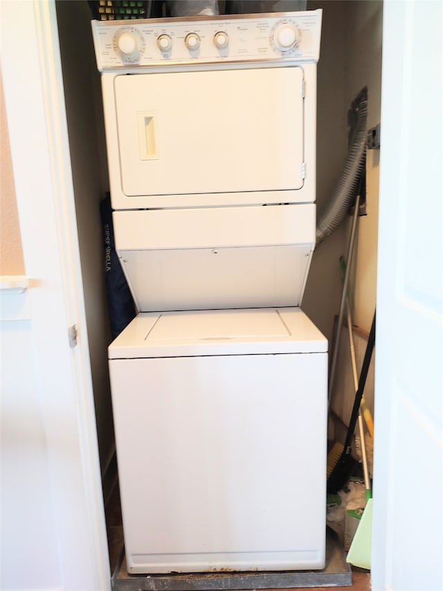 washroom with stacked washer and clothes dryer