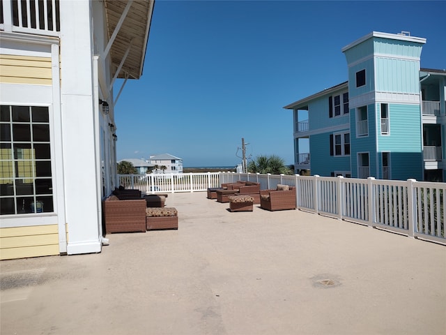 view of patio / terrace featuring a balcony and an outdoor living space