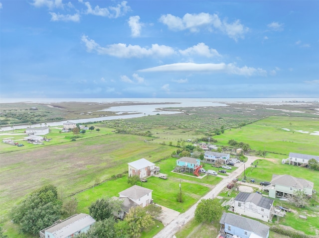 aerial view with a rural view and a water view