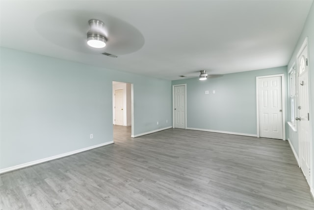 spare room featuring hardwood / wood-style flooring and ceiling fan