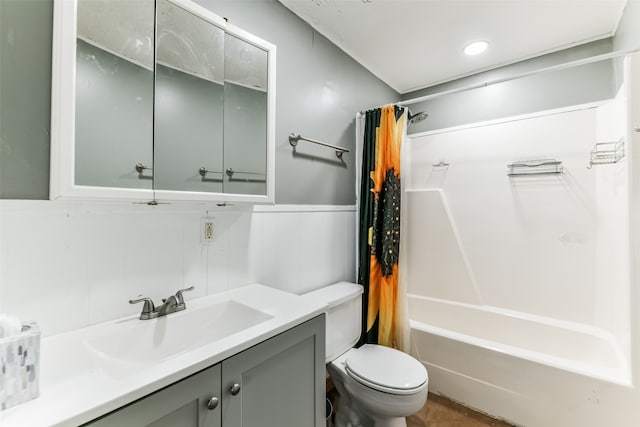 full bathroom with tile walls, oversized vanity, toilet, and shower / tub combo