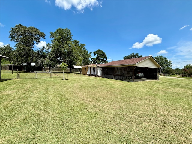 view of yard with a carport