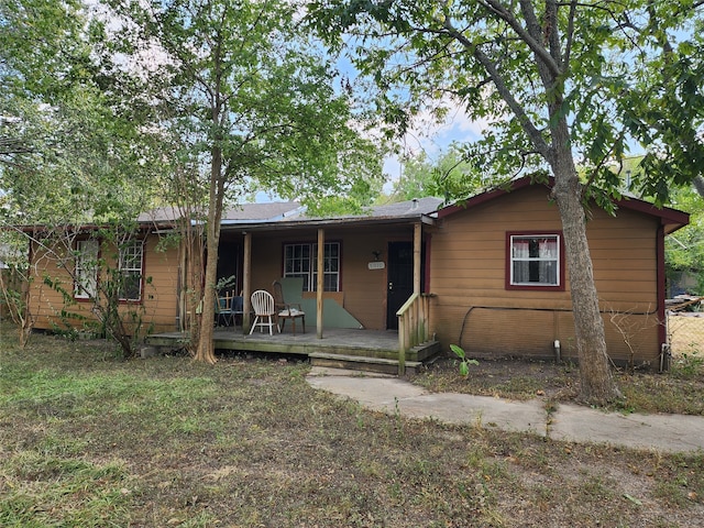 single story home featuring covered porch