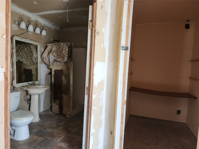 bathroom with tile flooring and toilet