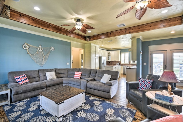 living room with ceiling fan, decorative columns, ornamental molding, dark hardwood / wood-style floors, and french doors