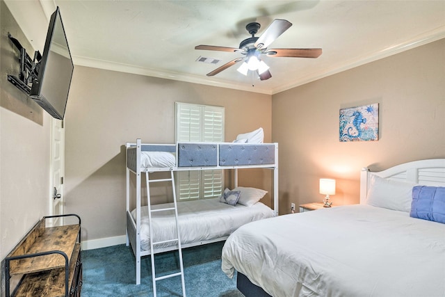 bedroom featuring dark carpet, ornamental molding, and ceiling fan