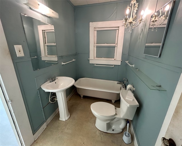 bathroom featuring tile floors, toilet, a bath, and a chandelier