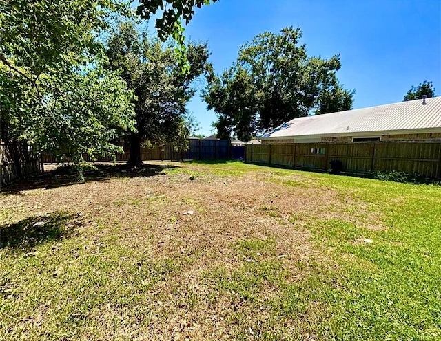 911 Dallas St, Port Neches, TX 77651 - view of yard with a fenced backyard