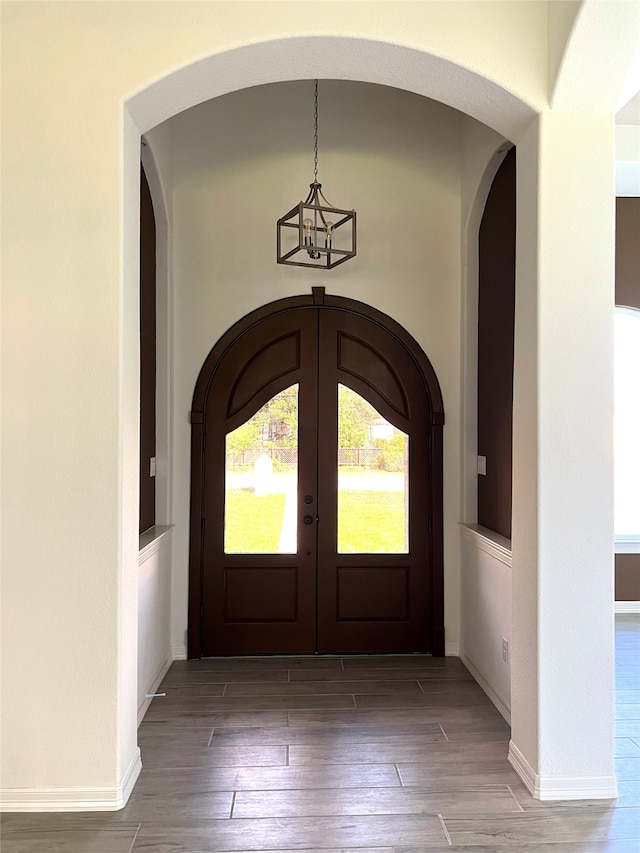 entrance foyer with hardwood / wood-style flooring and french doors