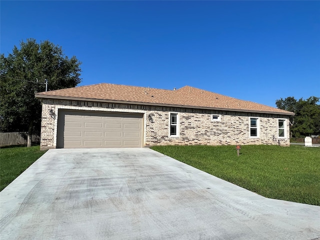 ranch-style house with a front yard and a garage